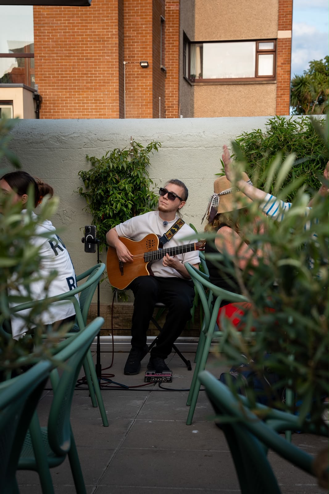 Live guitarist performing on the patio