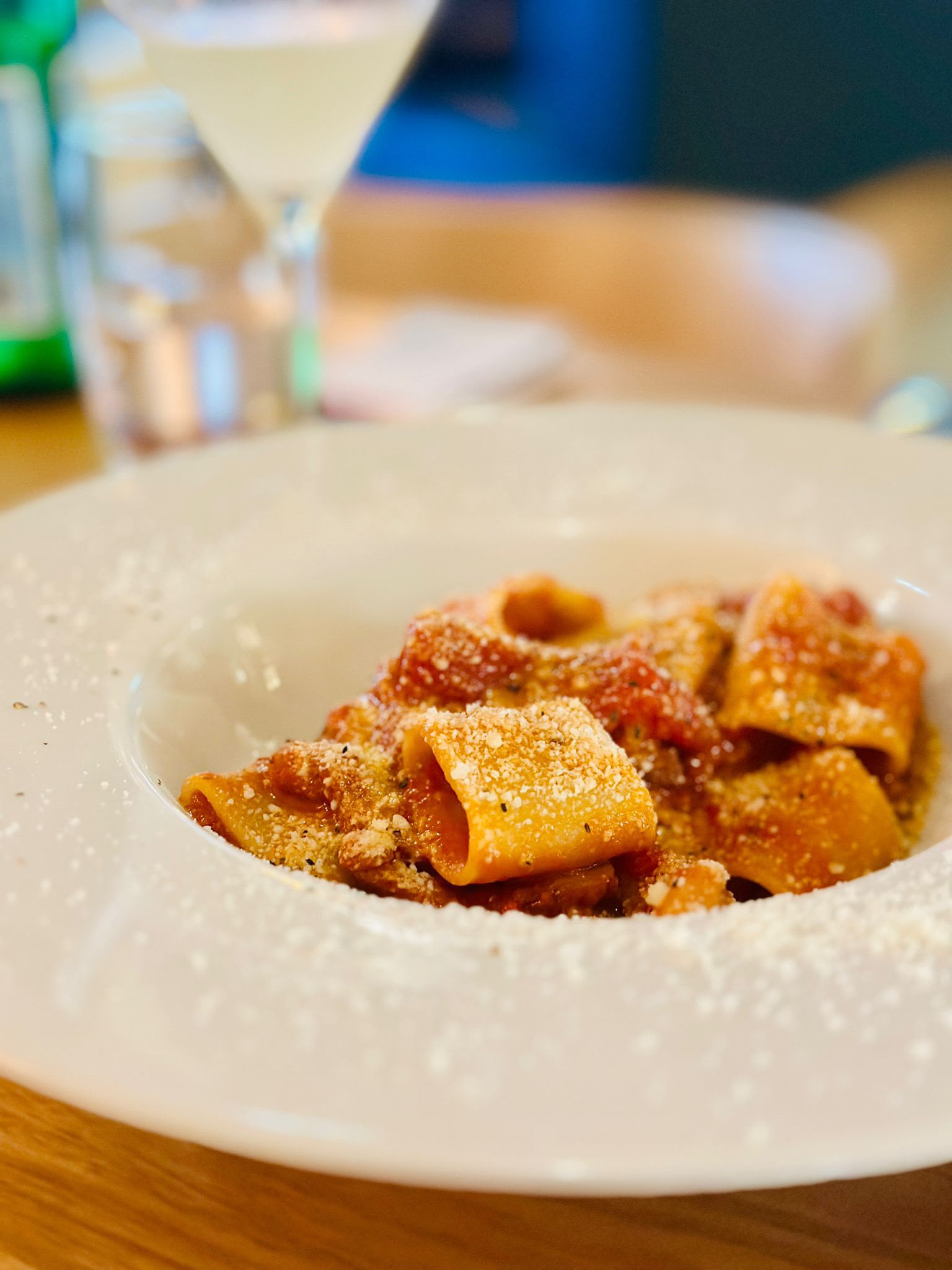 Fresh pasta in a rich tomato sauce with shaved parmesan