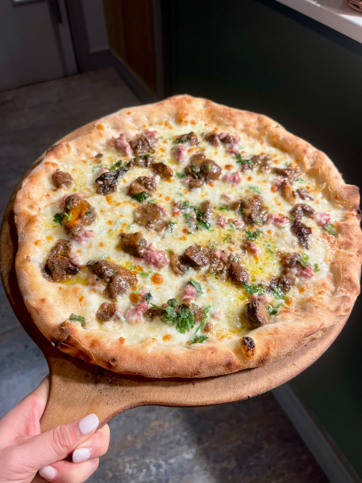 Wood-fired white pizza with mushrooms