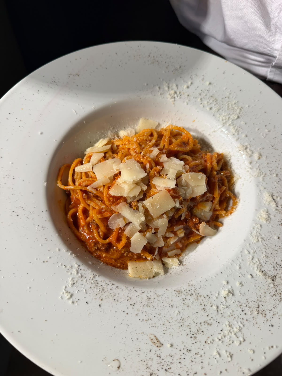 Tagliolini al ragù with shaved parmesan